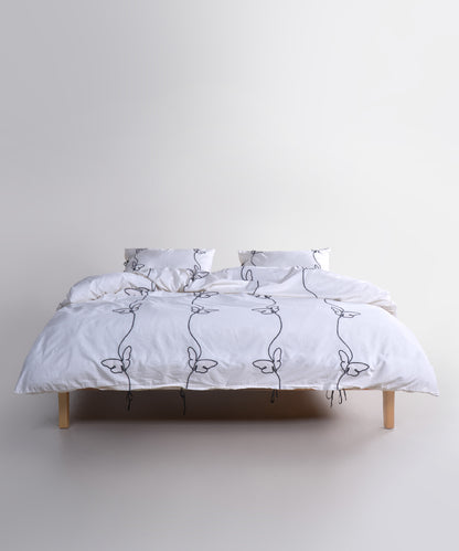 Styled full bed image featuring the Snow White butterfly embroidered duvet cover set for a bright, calm and elegant bedroom look.