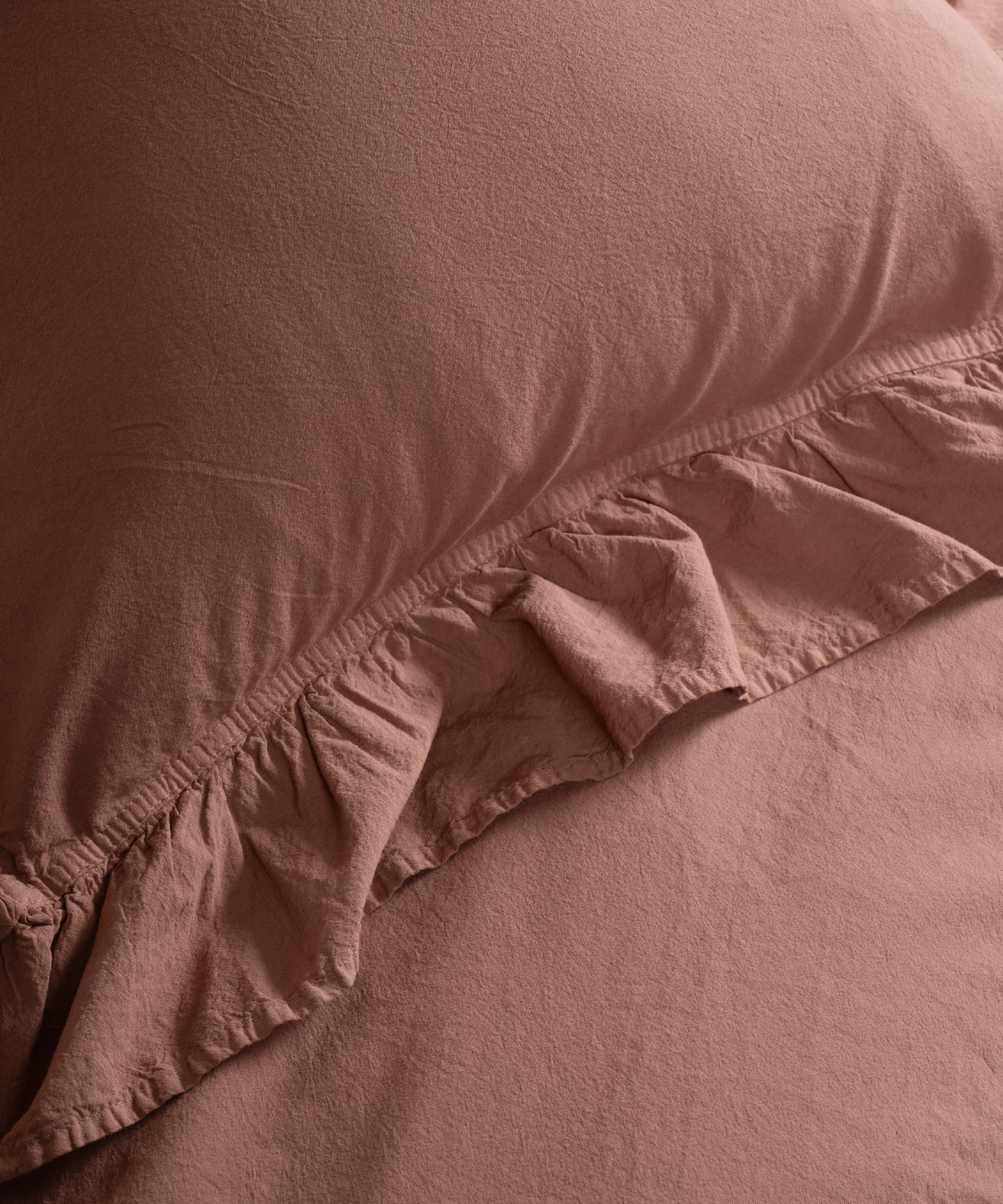 Textured stonewashed 100% cotton fabric close-up showing breathable soft weave ideal for all-season UK bedding