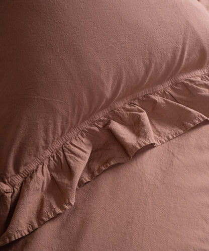 Textured stonewashed 100% cotton fabric close-up showing breathable soft weave ideal for all-season UK bedding