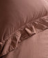 Textured stonewashed 100% cotton fabric close-up showing breathable soft weave ideal for all-season UK bedding