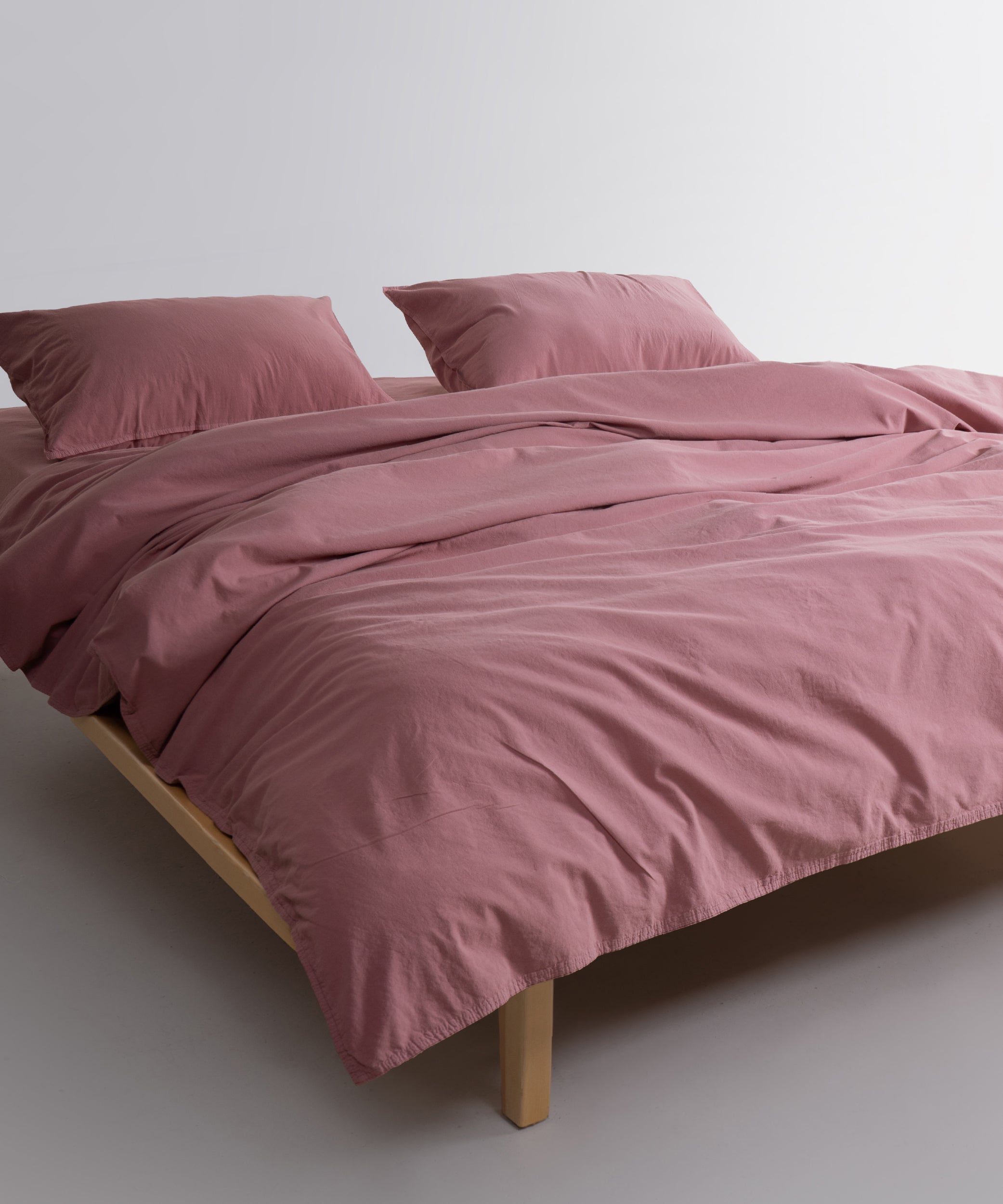Flowing Old Rose stonewashed cotton duvet cover showing natural drape and relaxed finish
