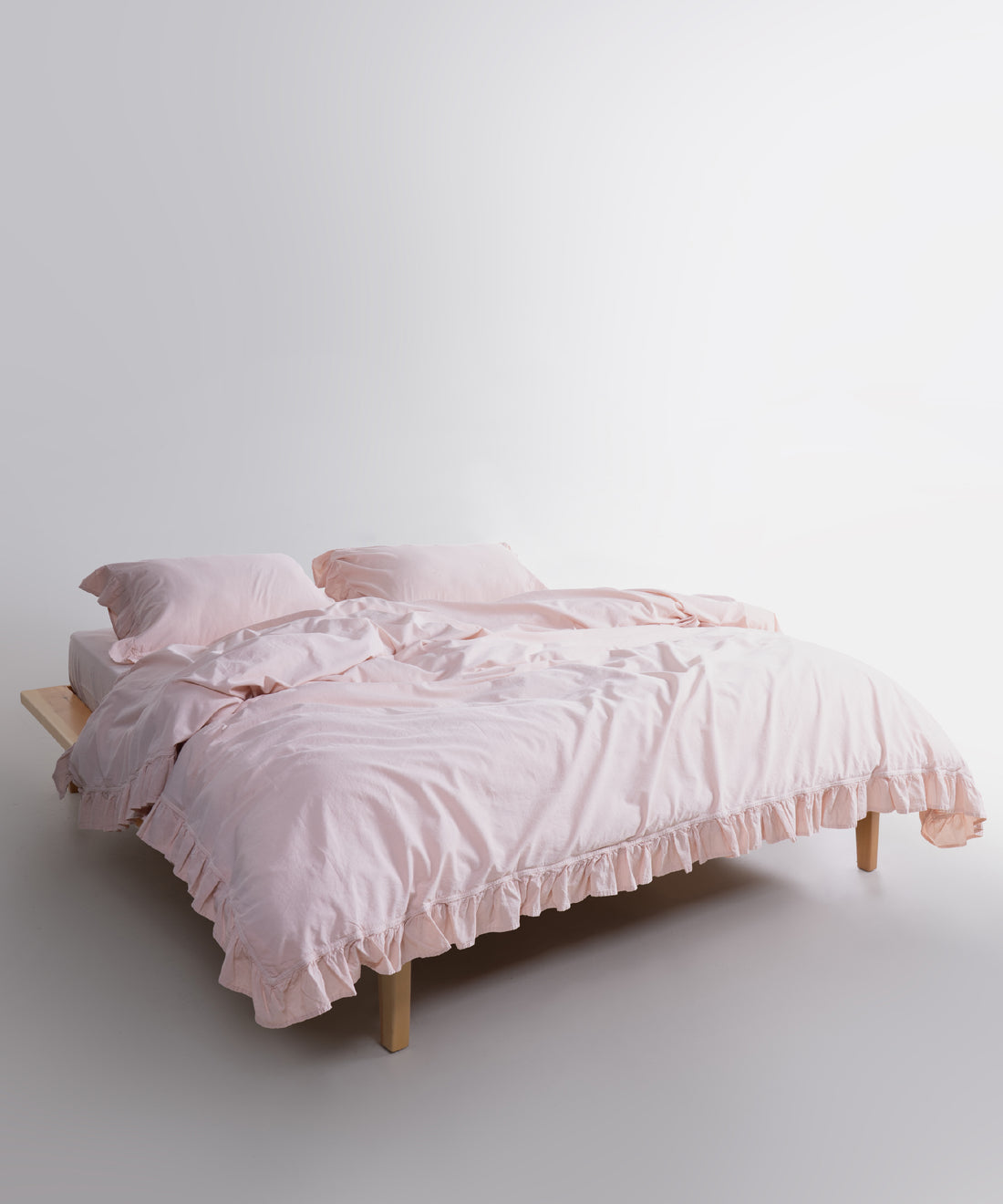 Close up of stonewashed cotton fabric texture in Pristine white duvet cover set, natural breathable bedding