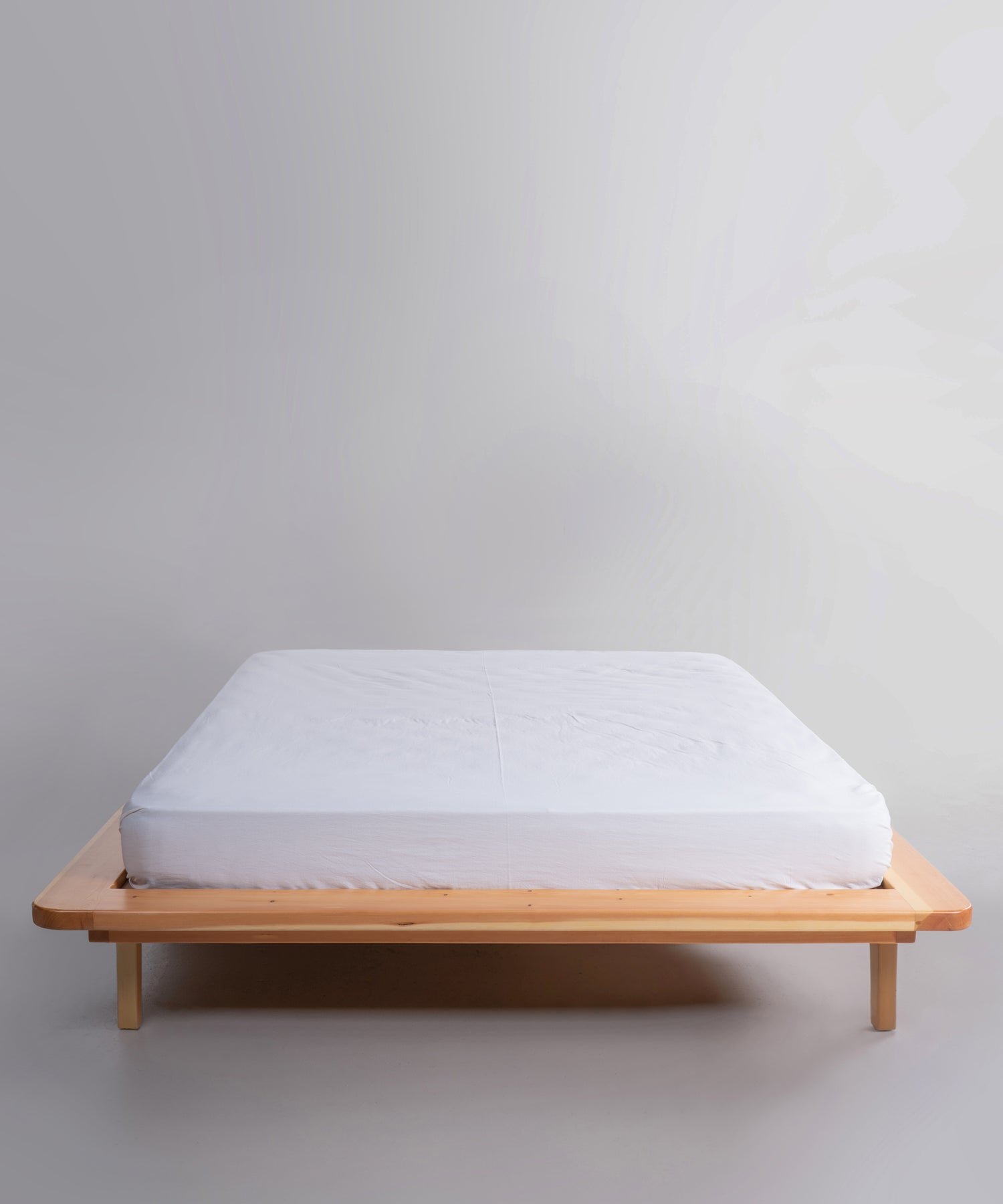 White stonewashed 100% cotton fitted sheet in Snow White colour, breathable deep pocket bedding for UK and US mattresses by Limasso London.