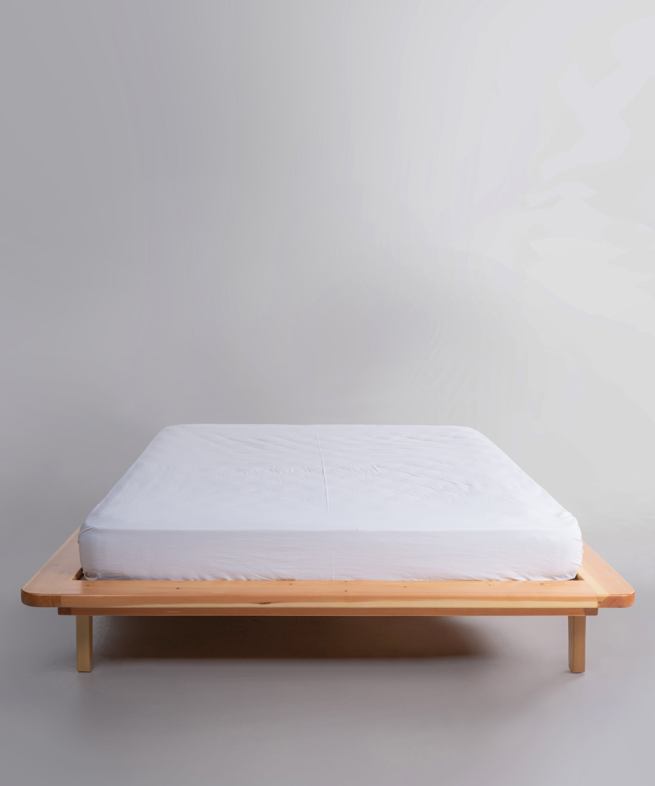 White stonewashed 100% cotton fitted sheet in Snow White colour, breathable deep pocket bedding for UK and US mattresses by Limasso London.