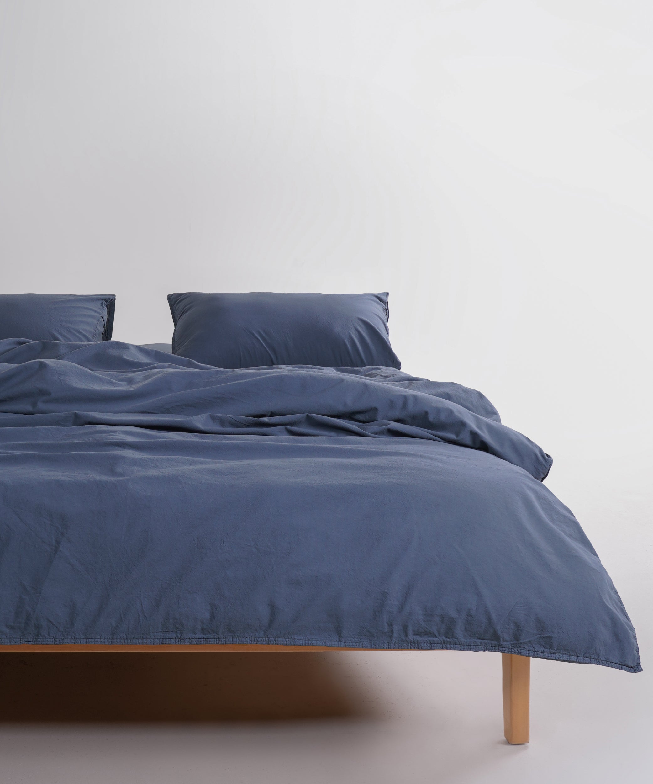 Stonewash 100% soft cotton duvet cover set in natural grey, styled on a UK bed with a relaxed stonewashed finish