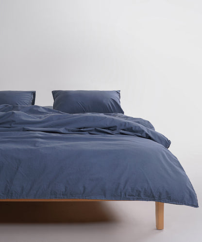 Stonewash 100% soft cotton duvet cover set in natural grey, styled on a UK bed with a relaxed stonewashed finish