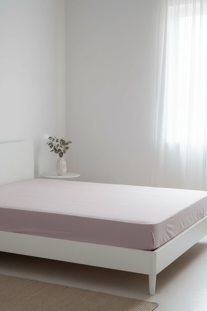 Stonewashed 100% cotton fitted sheet in natural cream, featuring a soft, breathable finish and a secure fit for UK mattresses. Available in multiple sizes and depth options for everyday comfort.