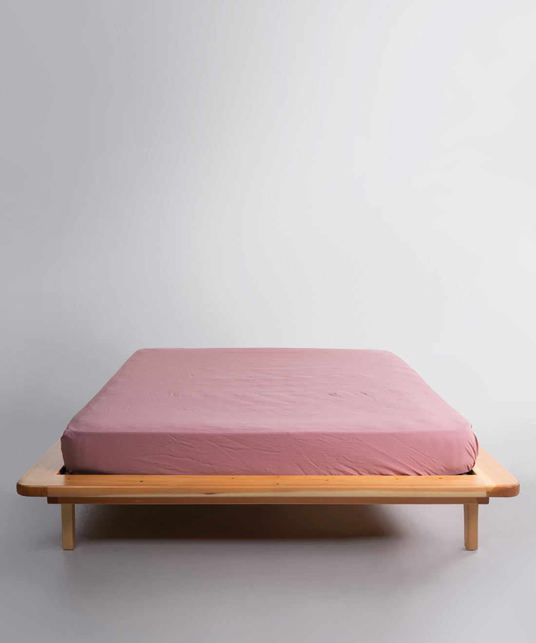 Old Rose stonewashed 100% cotton fitted sheet with soft natural texture and breathable finish, designed for UK mattresses.