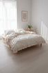 Stonewashed 100% cotton duvet cover set in natural cream, featuring soft ruffled edges and a relaxed, elegant look. Breathable, cosy and timeless bedding designed to create a calm and inviting bedroom atmosphere.