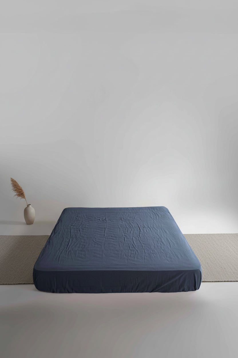 Stonewashed 100% cotton fitted sheet in Castle Rock colour by Limasso London. Soft, breathable cotton with a relaxed stonewashed finish,