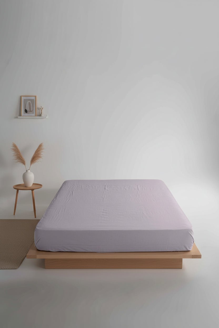 Stonewashed 100% cotton fitted sheet in Opal Grey, offering a soft, breathable feel and a calm, modern look. Designed for UK bed sizes with deep-fit options up to 40 cm for a secure and elegant finish.