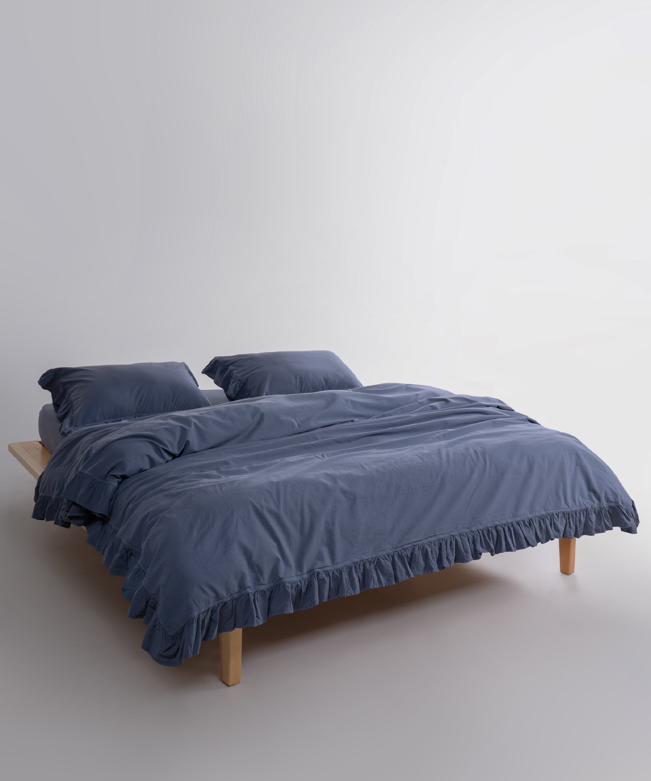 Close-up of stonewashed 100% cotton fabric in natural grey showing soft texture and breathable weave