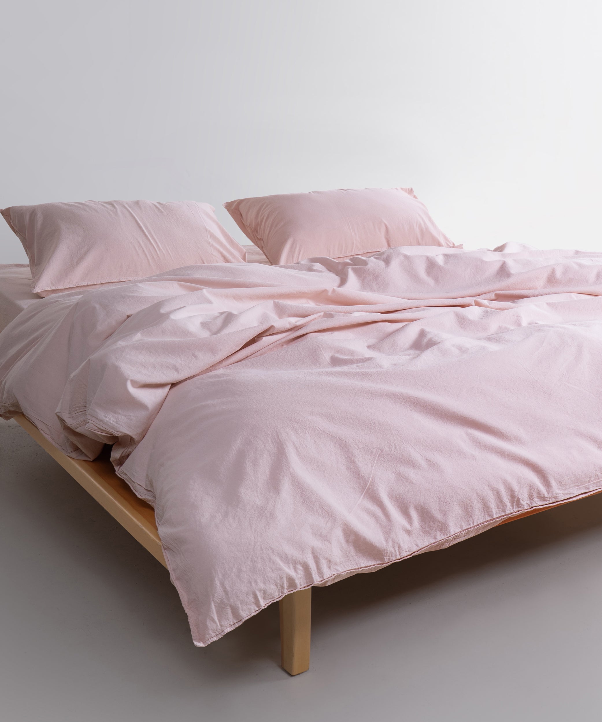 Close up texture of 100% stonewashed cotton duvet cover in Pristine white, soft breathable fabric