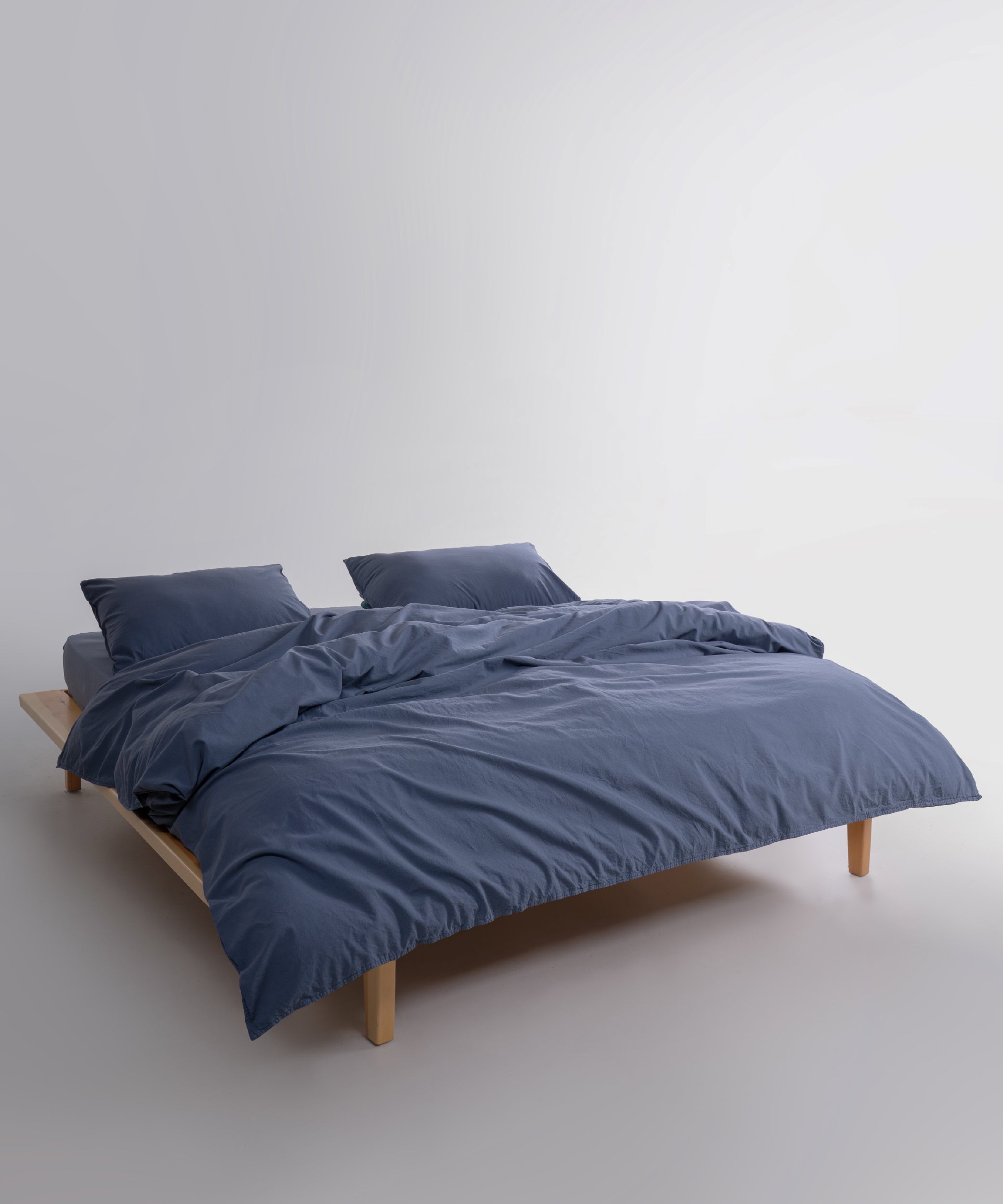 Close-up of stonewashed 100% cotton fabric in natural grey showing soft texture and breathable weave