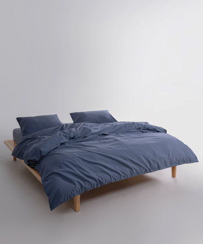 Close-up of stonewashed 100% cotton fabric in natural grey showing soft texture and breathable weave