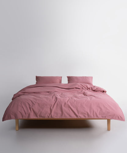 Close-up of stonewashed 100% cotton fabric in Old Rose showing soft texture and breathable weave