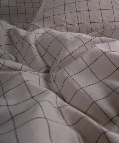 Close-up of the stonewashed 100% cotton fabric, showing its naturally soft feel and gently lived-in texture in Oxford Tan.