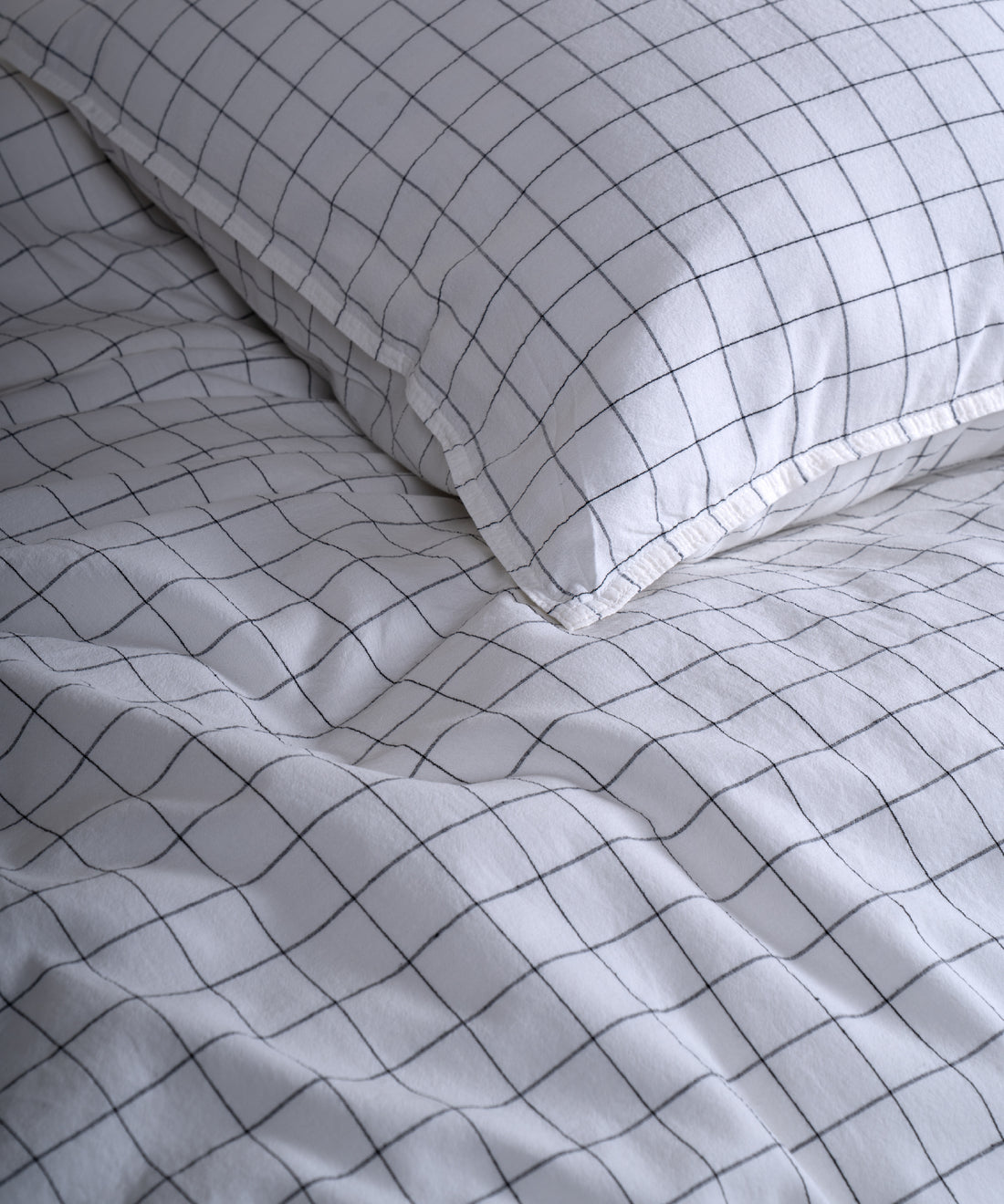 Close-up of the stonewashed 100% cotton fabric showing its naturally soft feel and gently lived-in texture in Snow White.