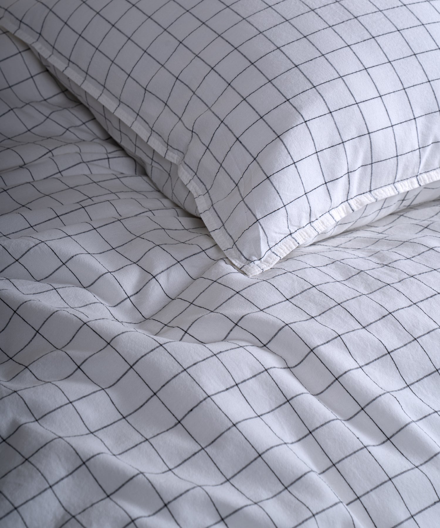 Close-up of the stonewashed 100% cotton fabric showing its naturally soft feel and gently lived-in texture in Snow White.