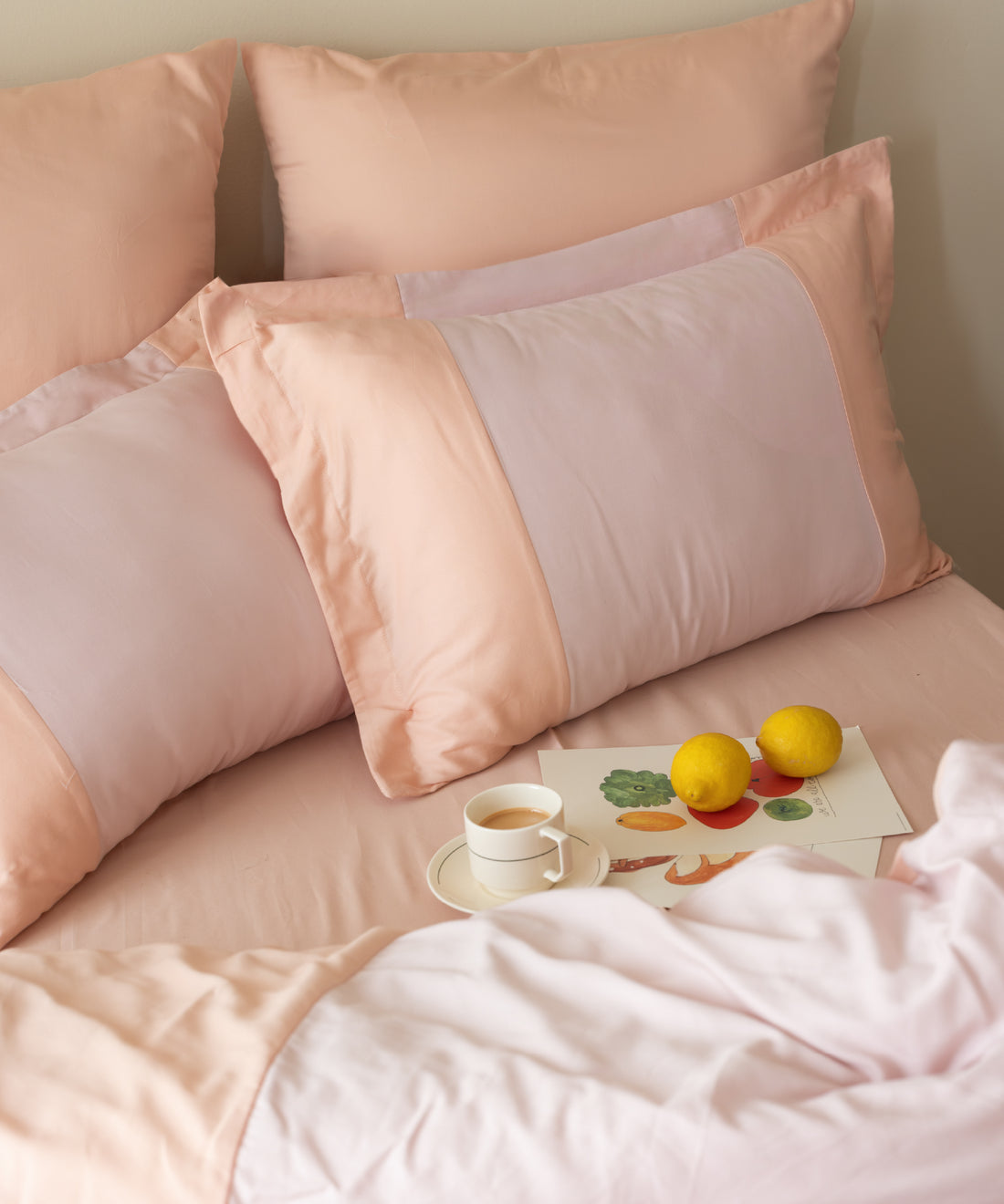 Close-up of 210TC Sateen Duvet Cover Set Toast and Pristine pillowcases showing silky sateen texture – Limasso London