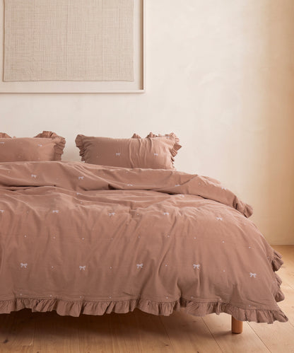 Stonewashed Wood Smoke cotton duvet cover set styled in contemporary neutral UK bedroom