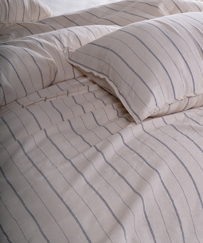 Cotton pillowcase with envelope closure in natural cream and navy stripe design