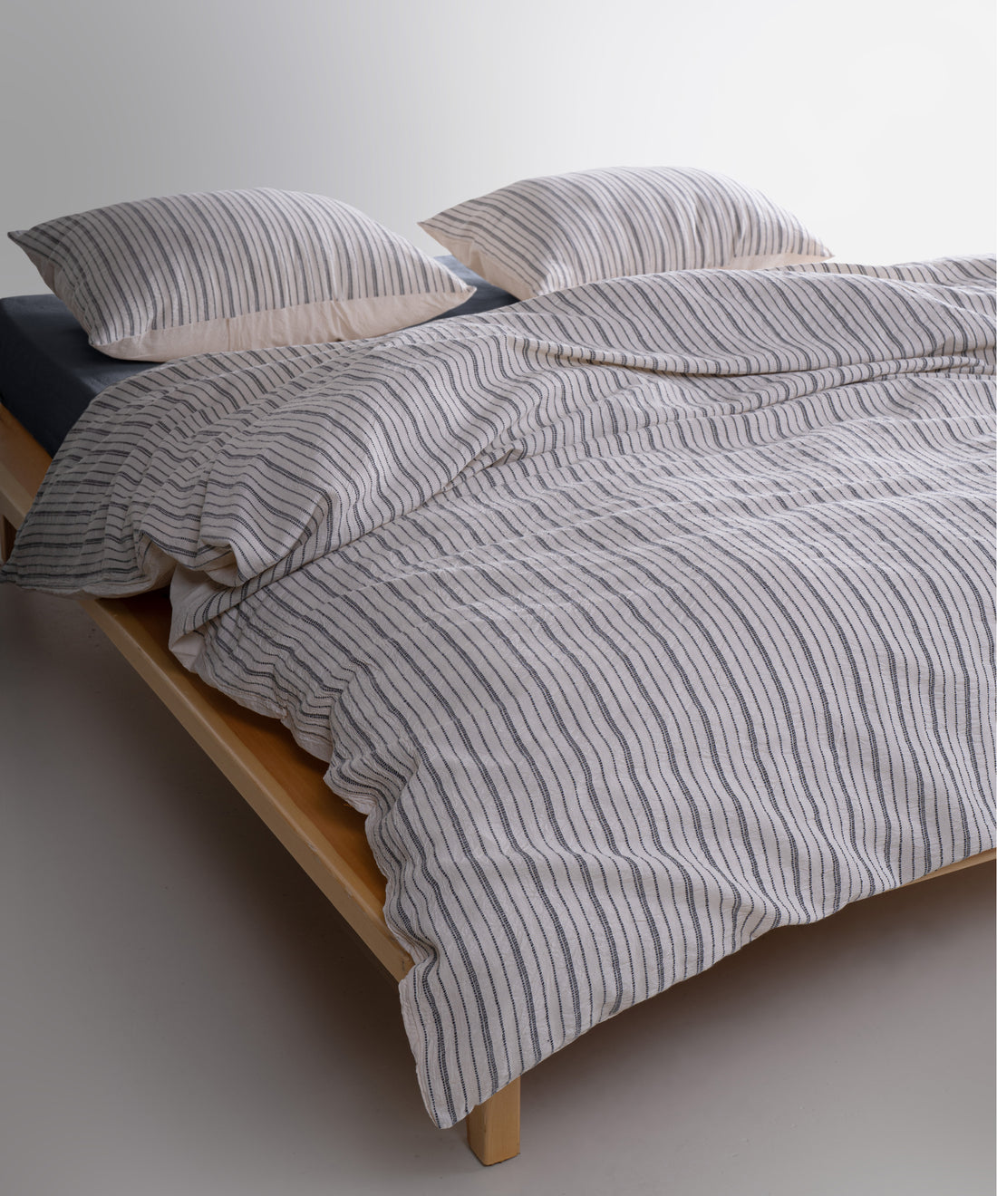 Button closure detail on garment washed 100% cotton duvet cover