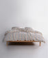Garment washed 100% cotton duvet cover set in natural cream with soft blue, blush and yellow stripes