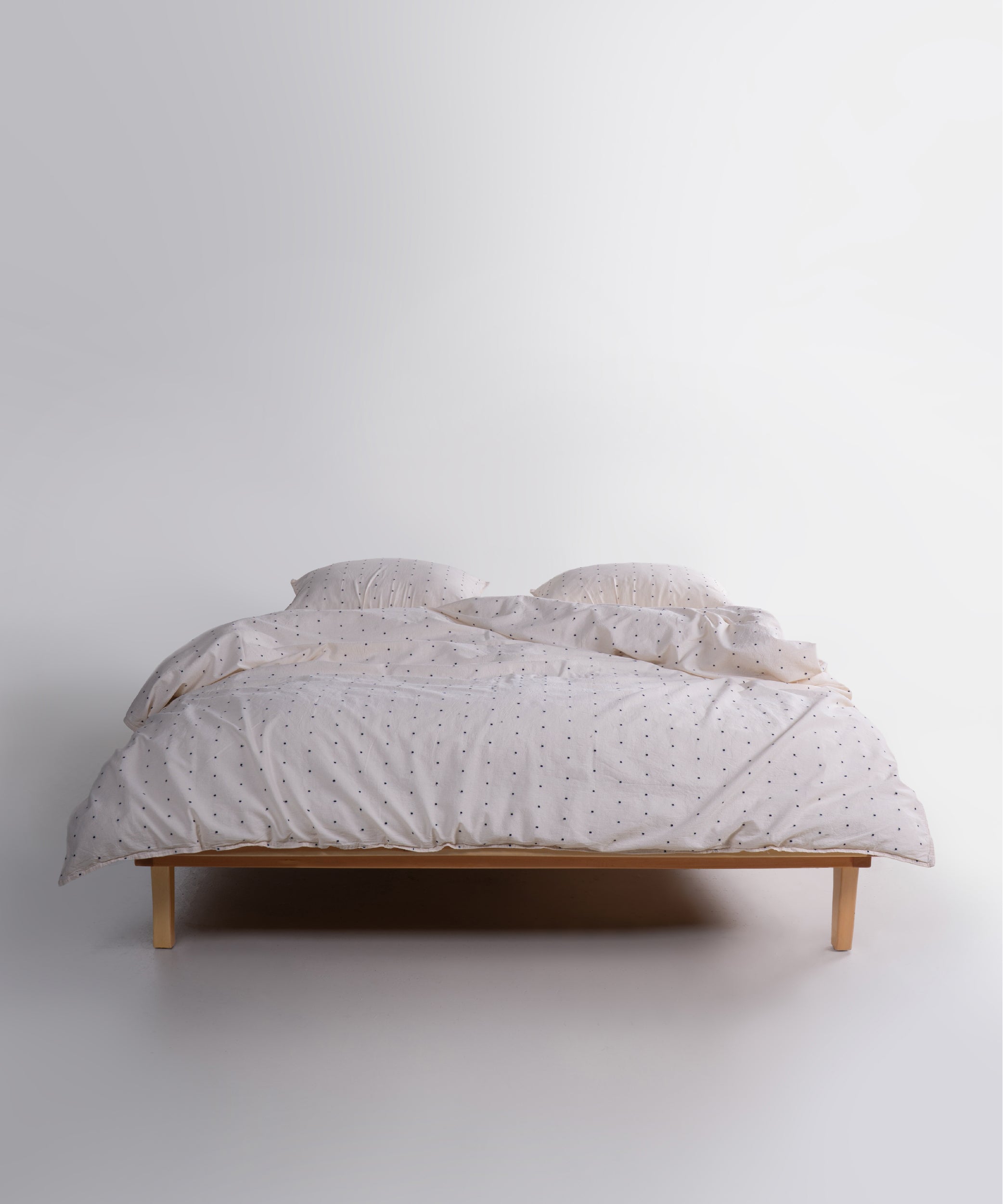 Garment washed 100% cotton duvet cover set in natural cream with black speckles, soft breathable bedding for UK bedrooms