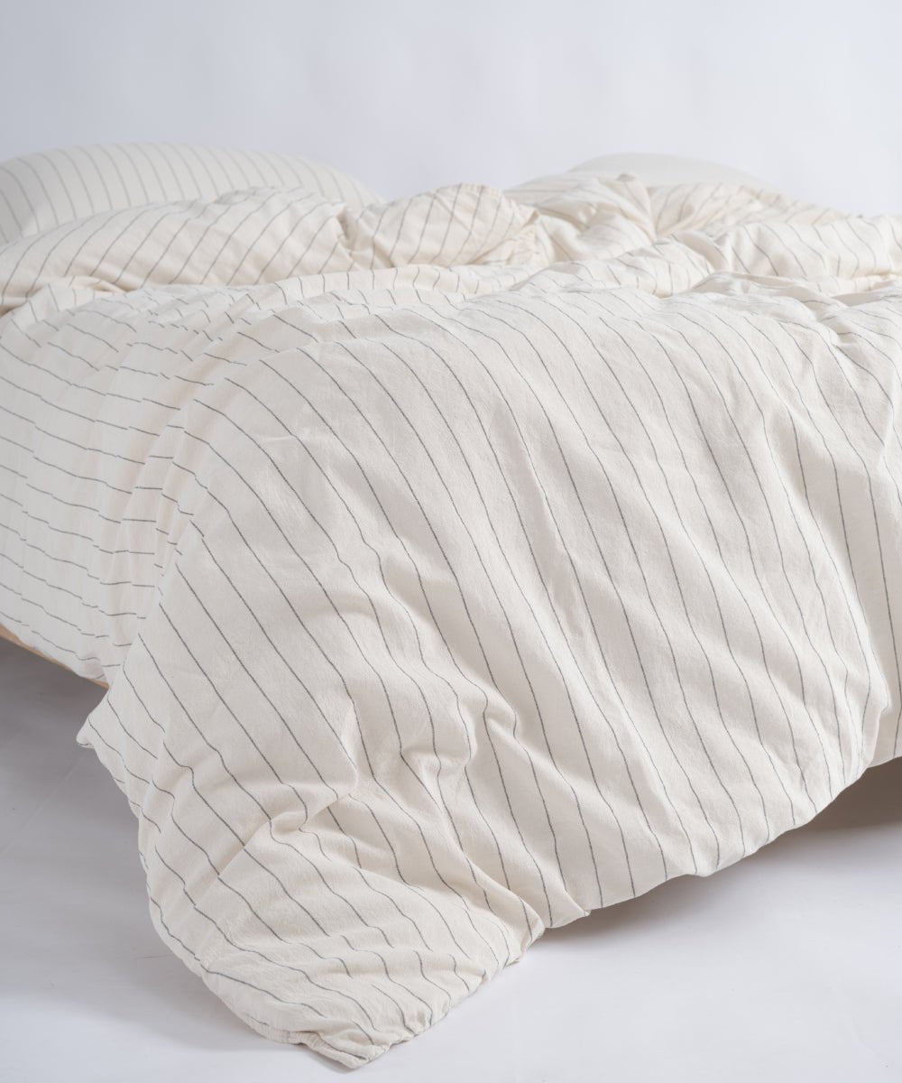 Close-up of garment washed cotton fabric with black stripe detail