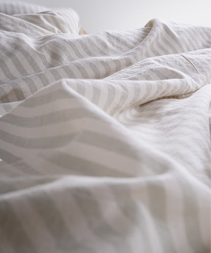 Close up of garment washed cotton fabric with soft green stripes