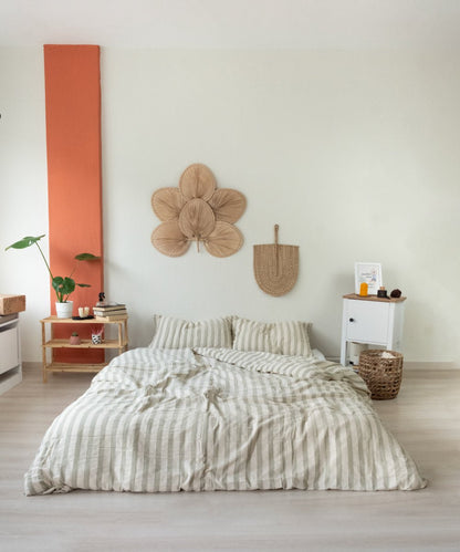 Green Wood striped cotton duvet cover set styled on bed, minimalist natural bedroom decor