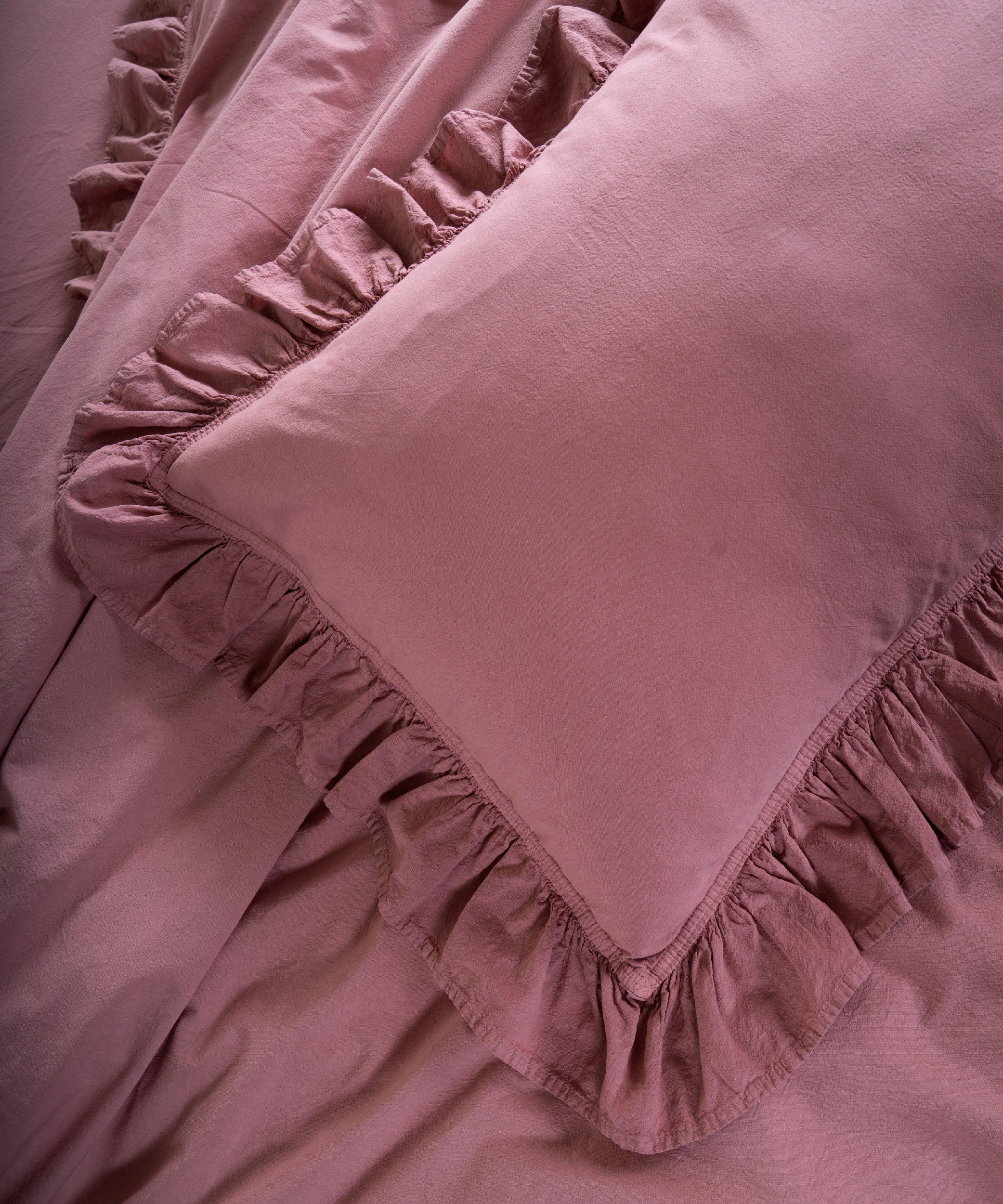 Old rose cotton pillowcase with ruffle trim and envelope closure from stonewash duvet cover set