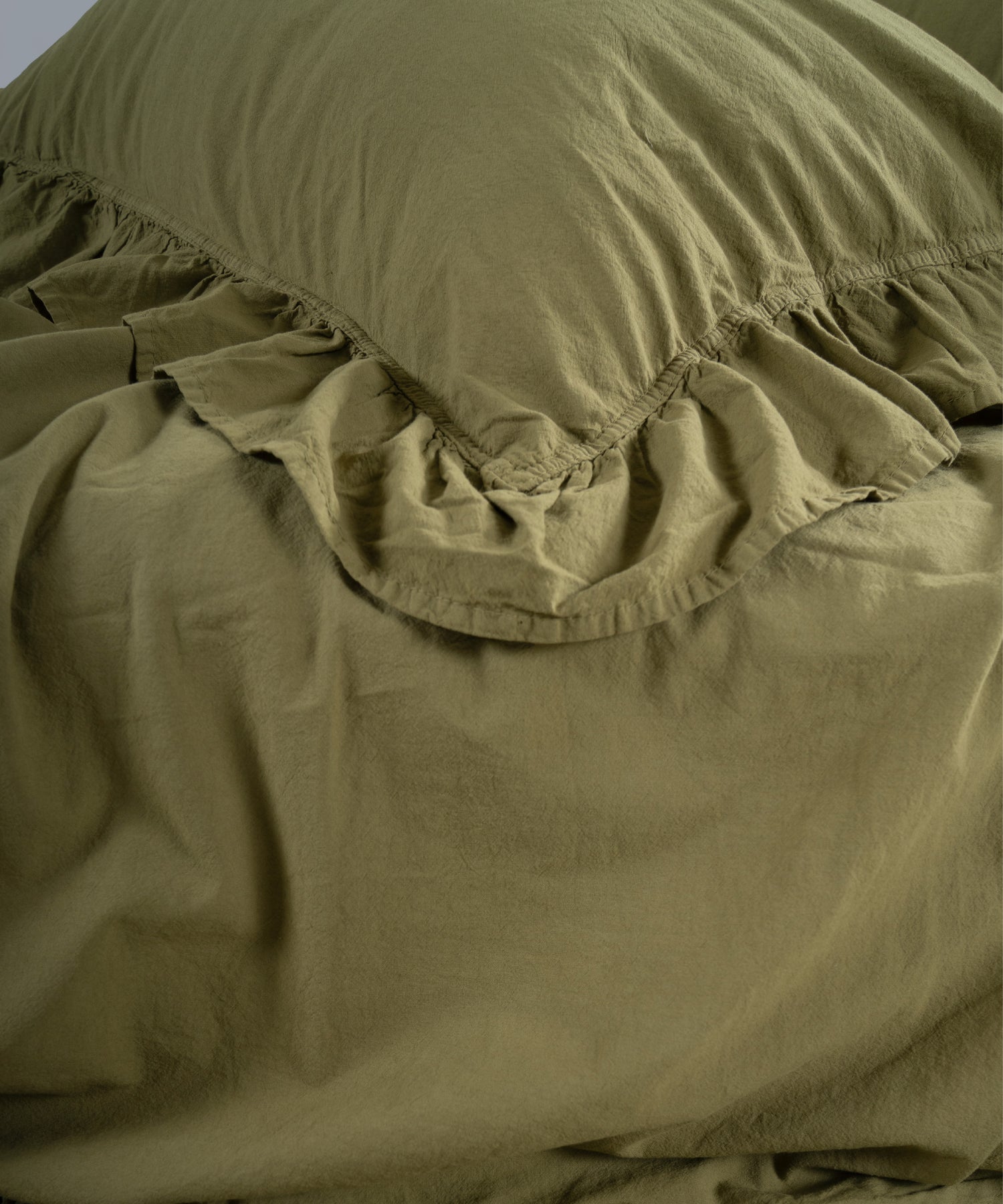 Olive green cotton pillowcase with envelope closure and ruffled trim