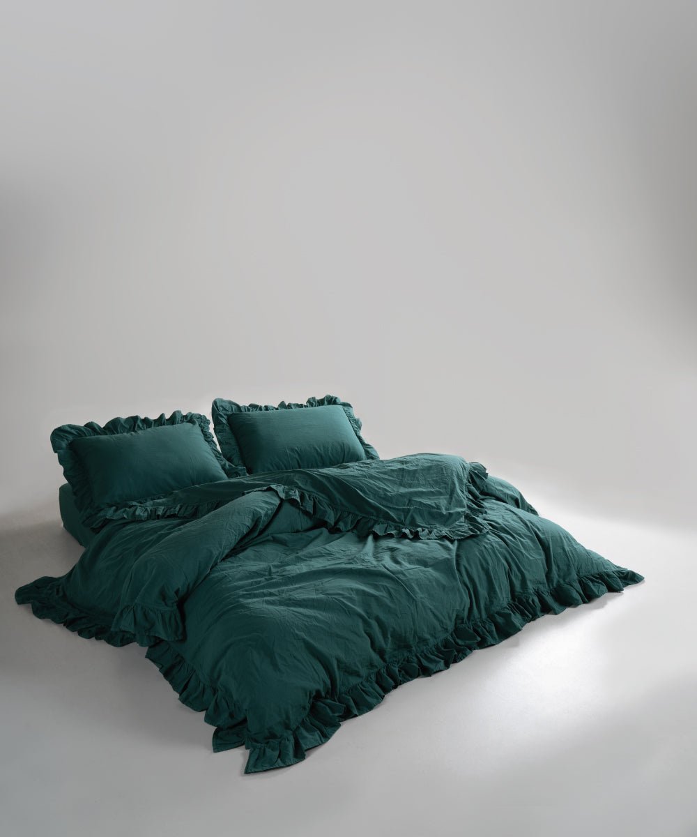 Stonewash 100% soft cotton duvet cover set in exclusive dark green with ruffle detailing by Limasso London