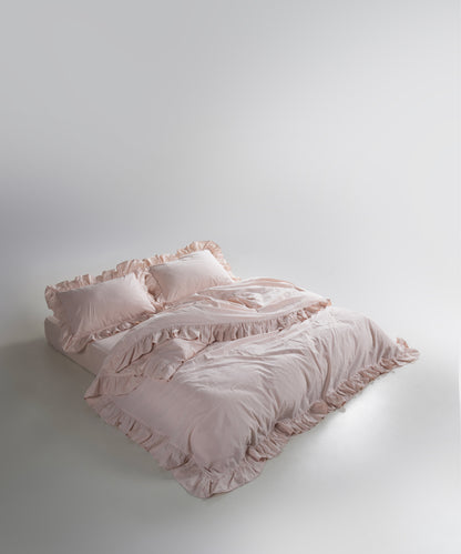 Close-up of ruffle trim on stonewash soft cotton duvet cover set in pristine shade