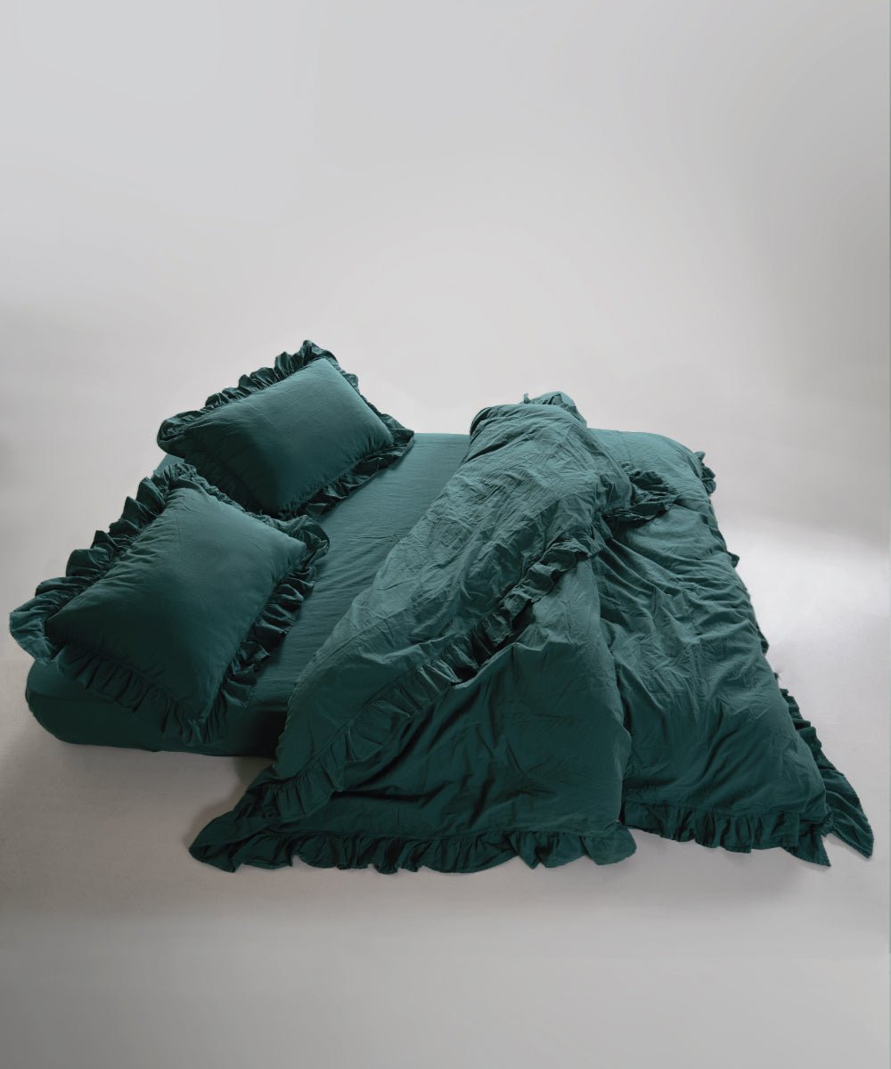 Stonewash exclusive dark green duvet cover set styled on bed with relaxed European look