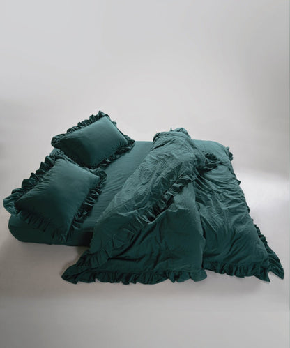 Stonewash exclusive dark green duvet cover set styled on bed with relaxed European look