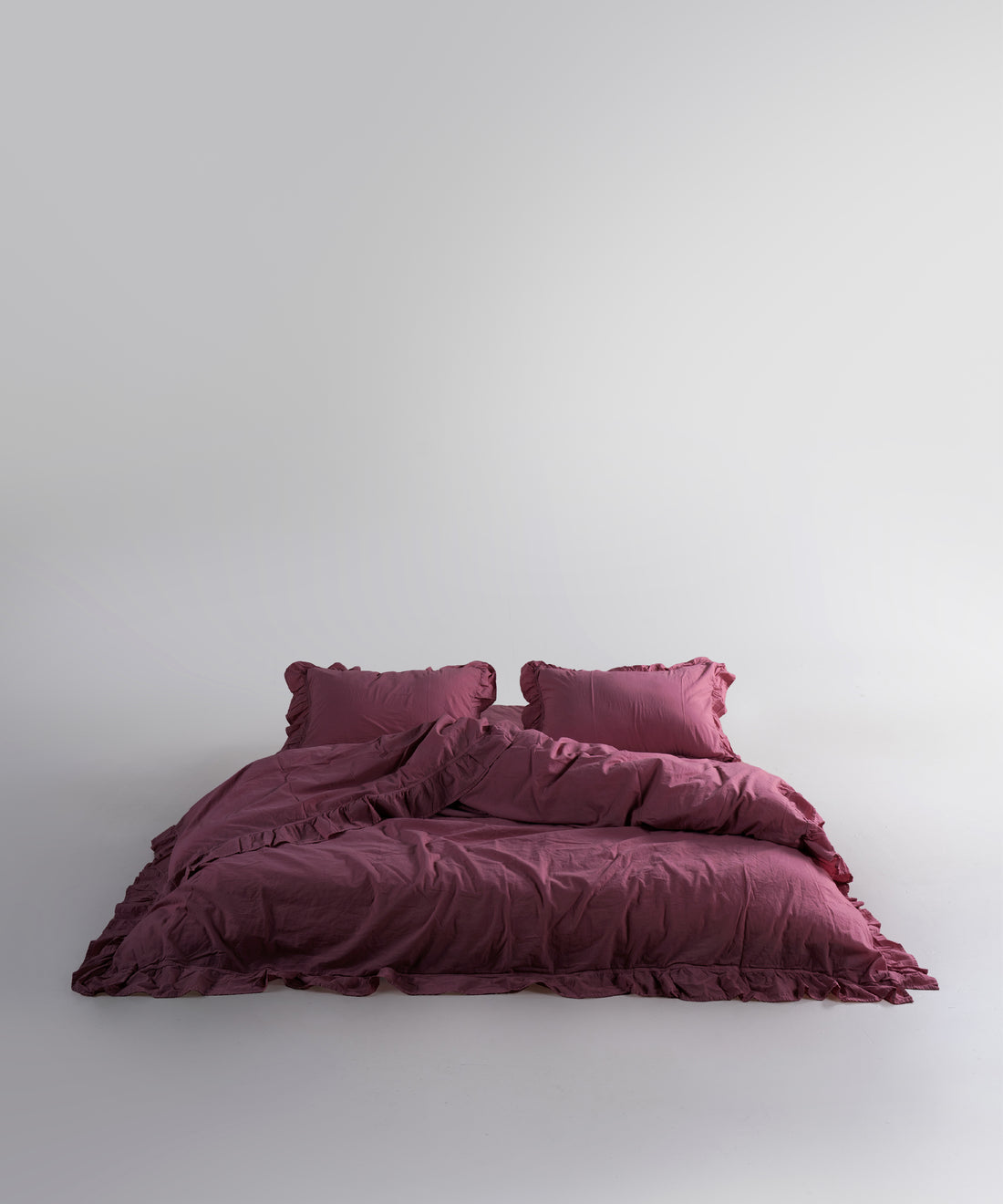 Stonewash exclusive 100% soft cotton duvet cover set in raspberry colour with ruffled edges, luxury bedding