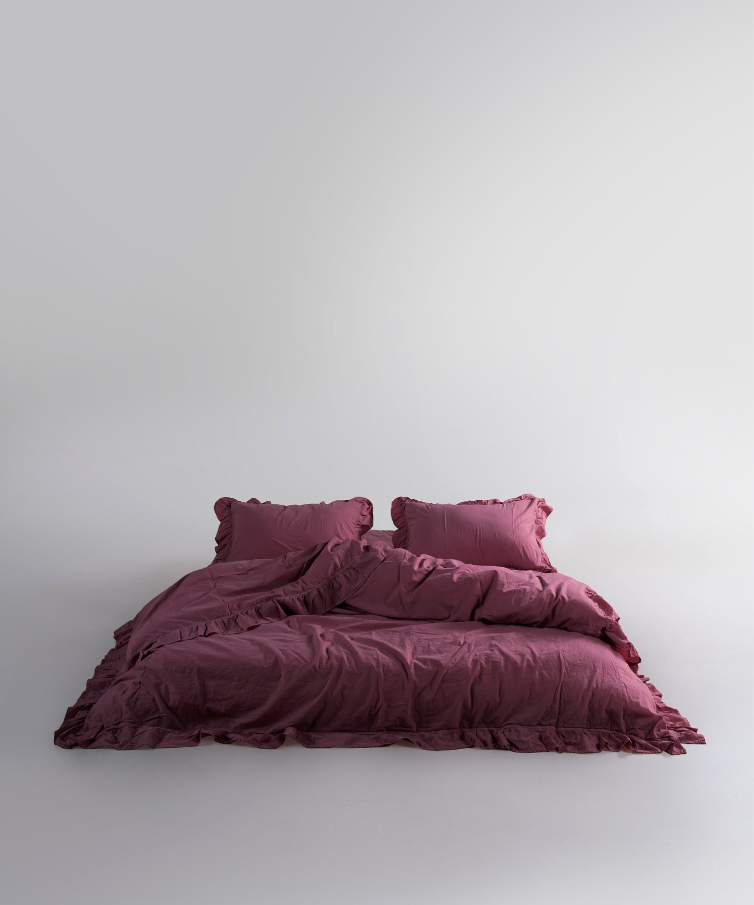 Stonewash exclusive 100% soft cotton duvet cover set in raspberry colour with ruffled edges, luxury bedding