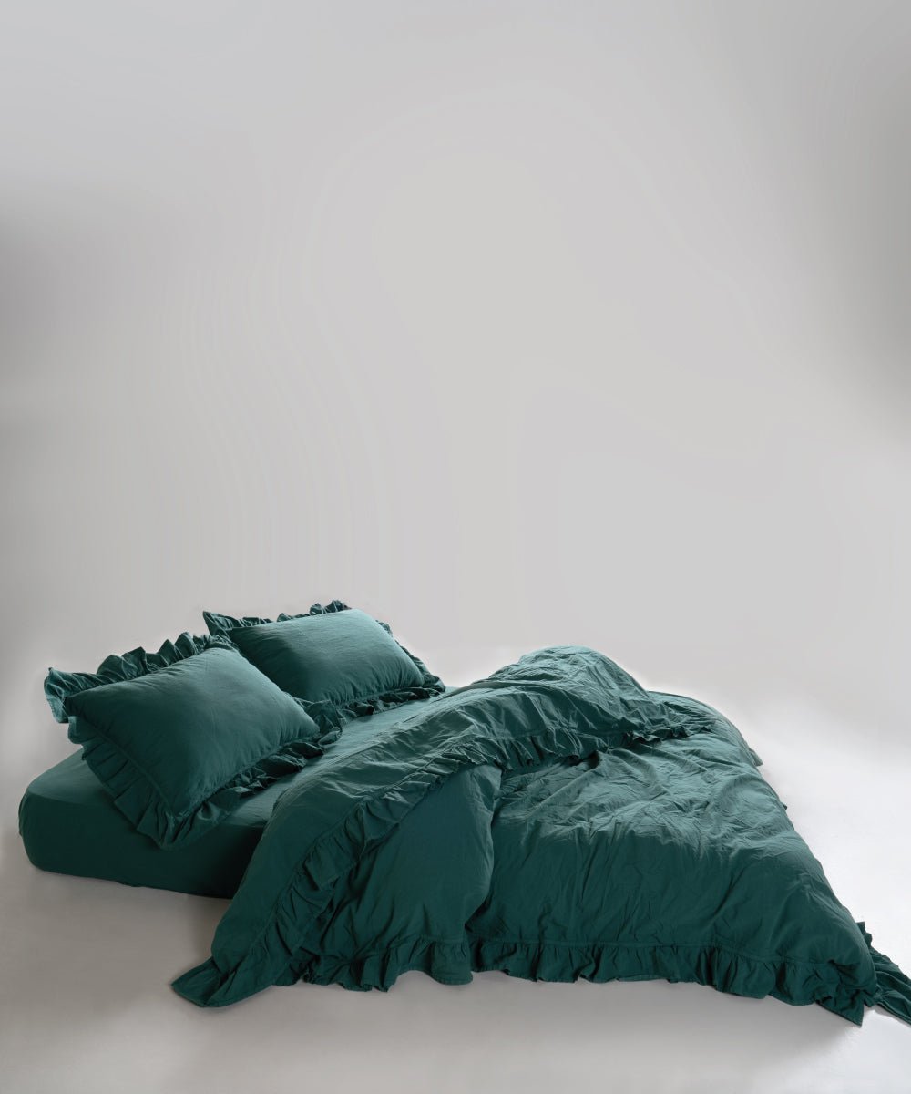 Close-up of stonewashed 100% soft cotton fabric in dark green duvet cover set