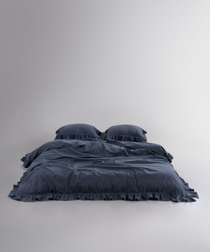 Stonewashed 100% cotton duvet cover set in Castle Rock anthracite with elegant ruffle detailing
