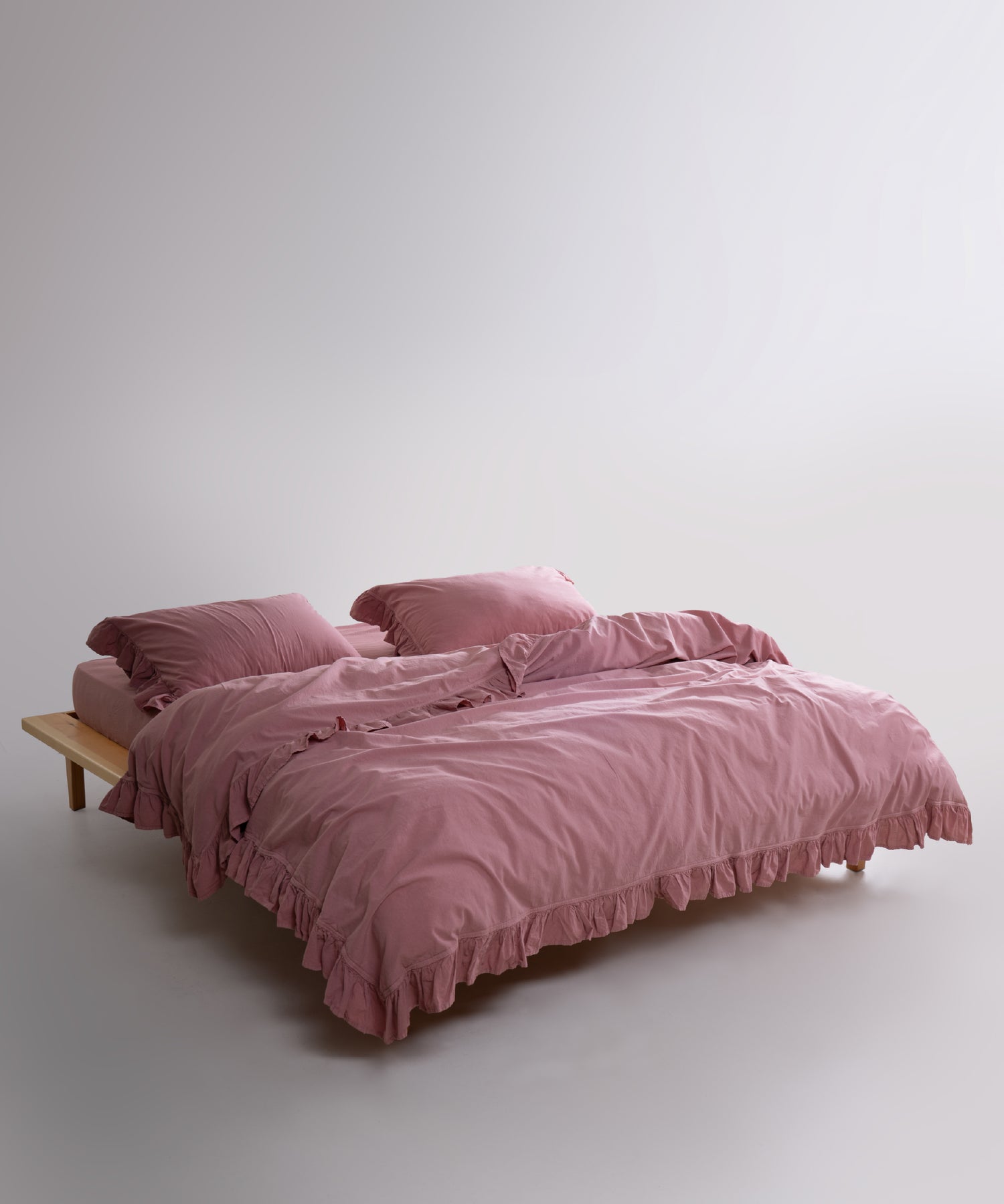 Stonewashed 100% cotton duvet cover set in old rose creating a warm and elegant bedroom look