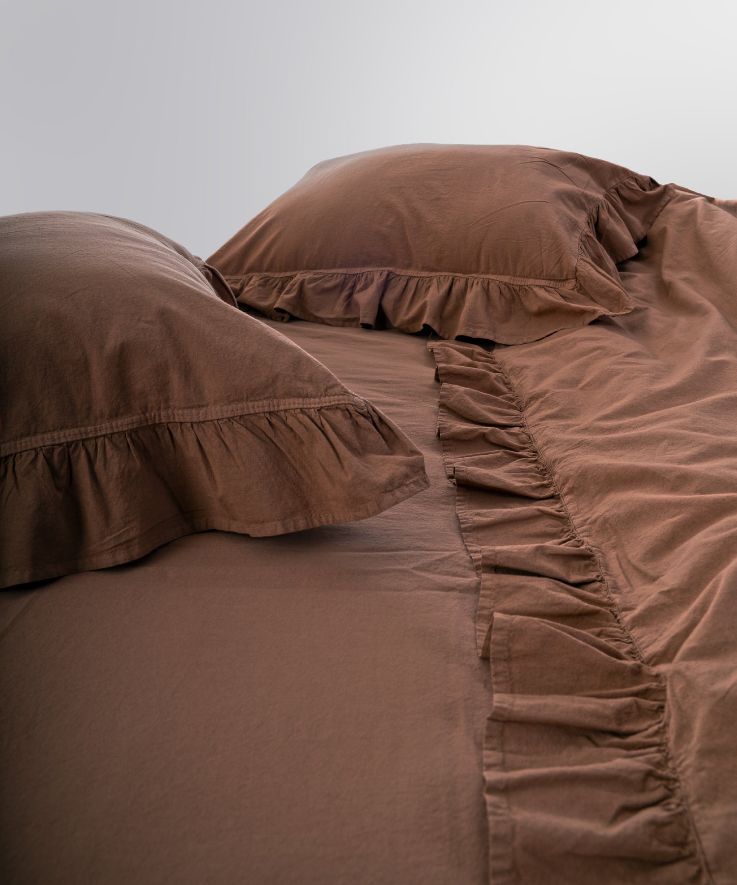 Stonewashed 100% cotton fabric texture showing soft, breathable and natural finish in wood smoke tone
